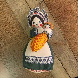 Louise Elliott designs stuffed doll with baby